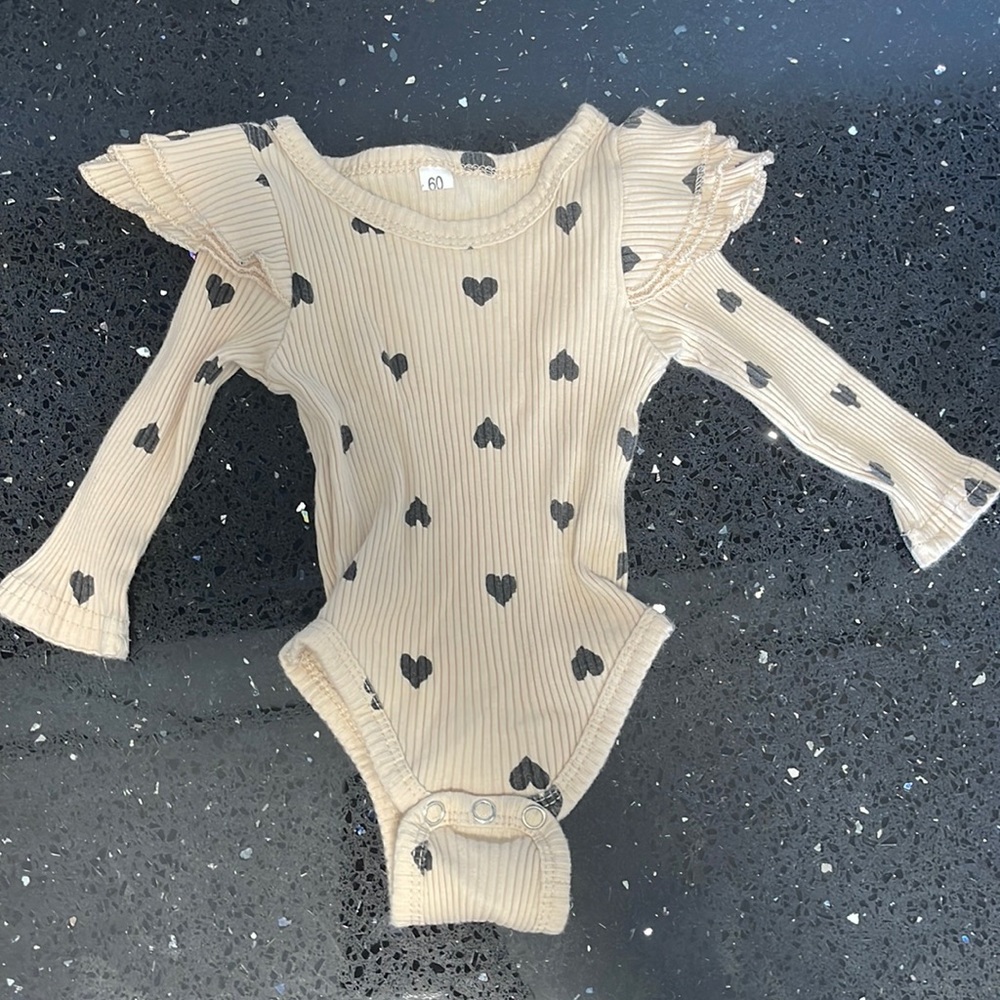Heart ruffle onesie